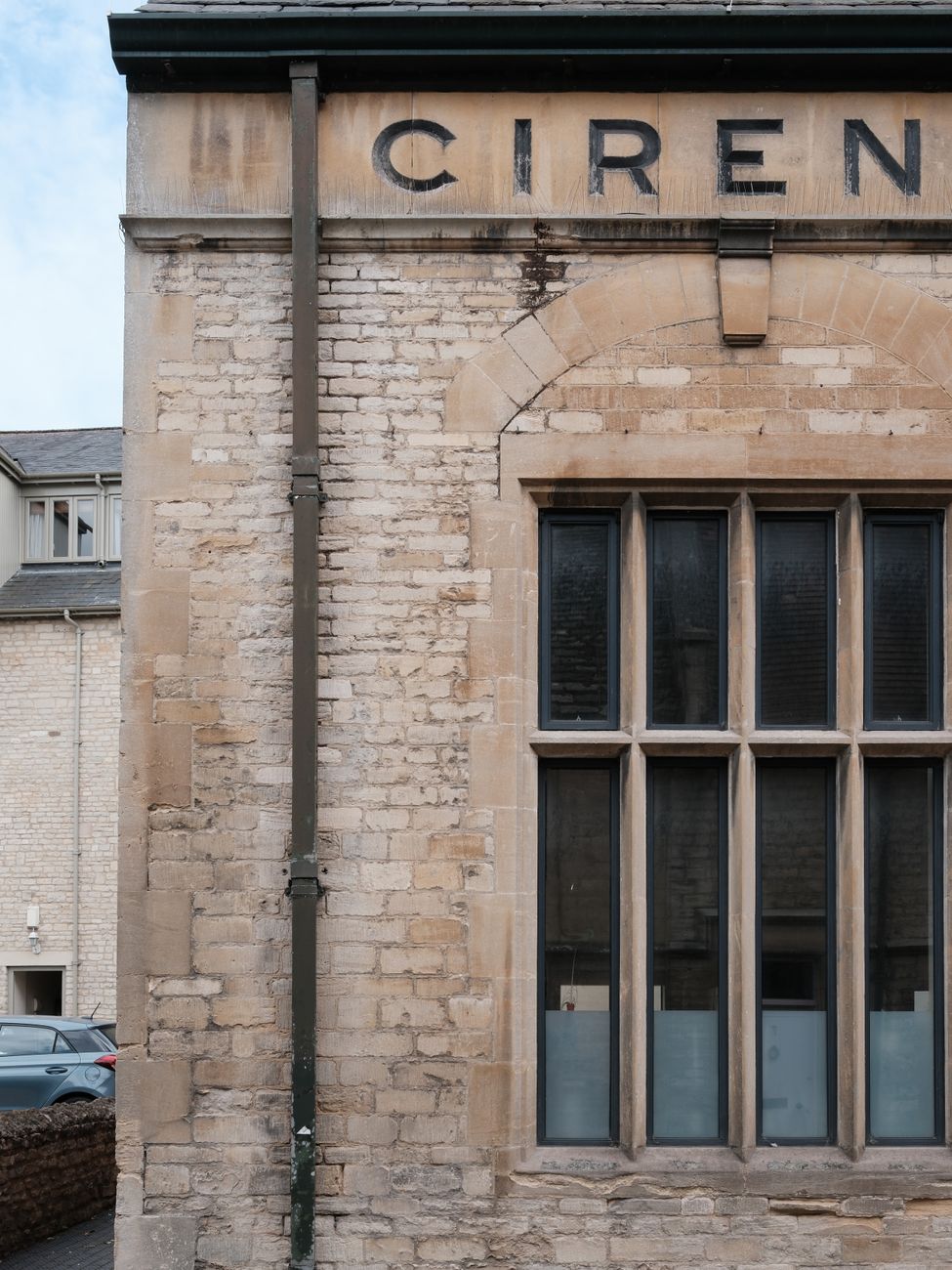 The coursed limestone facade of a Victorian civic building