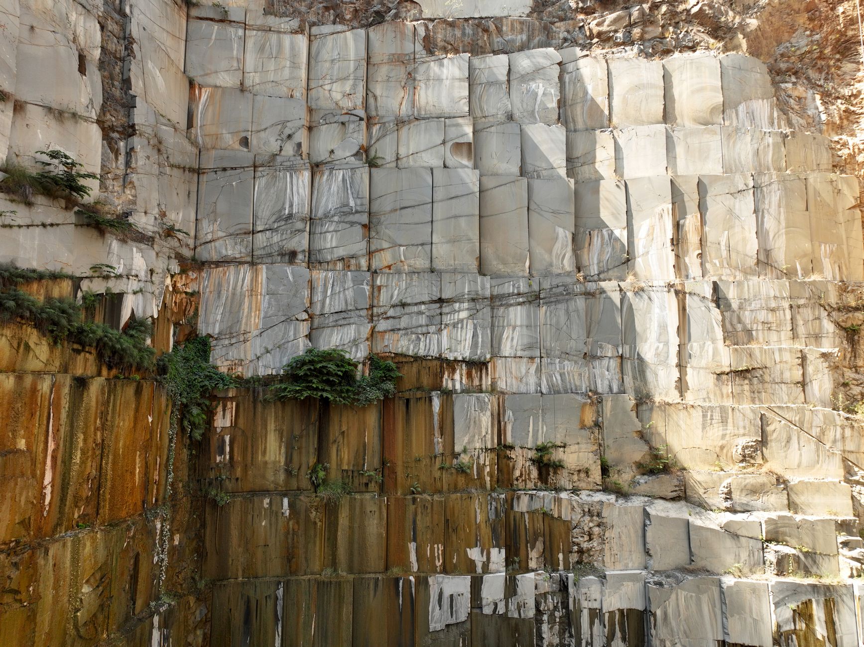 A quarry face of saw-cut limestone blocks