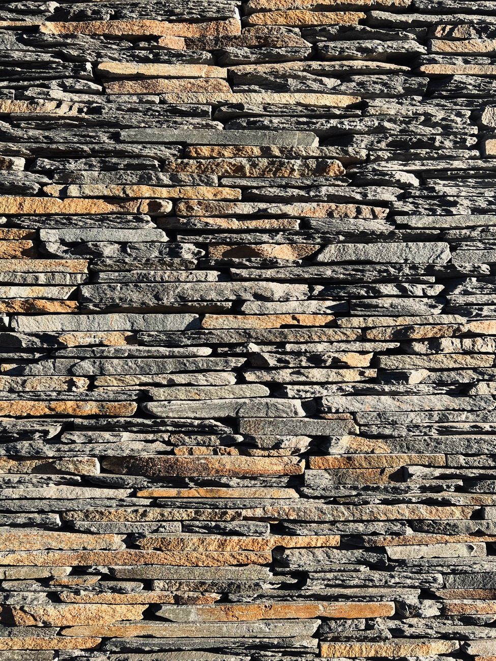 A dry-laid schist stone wall